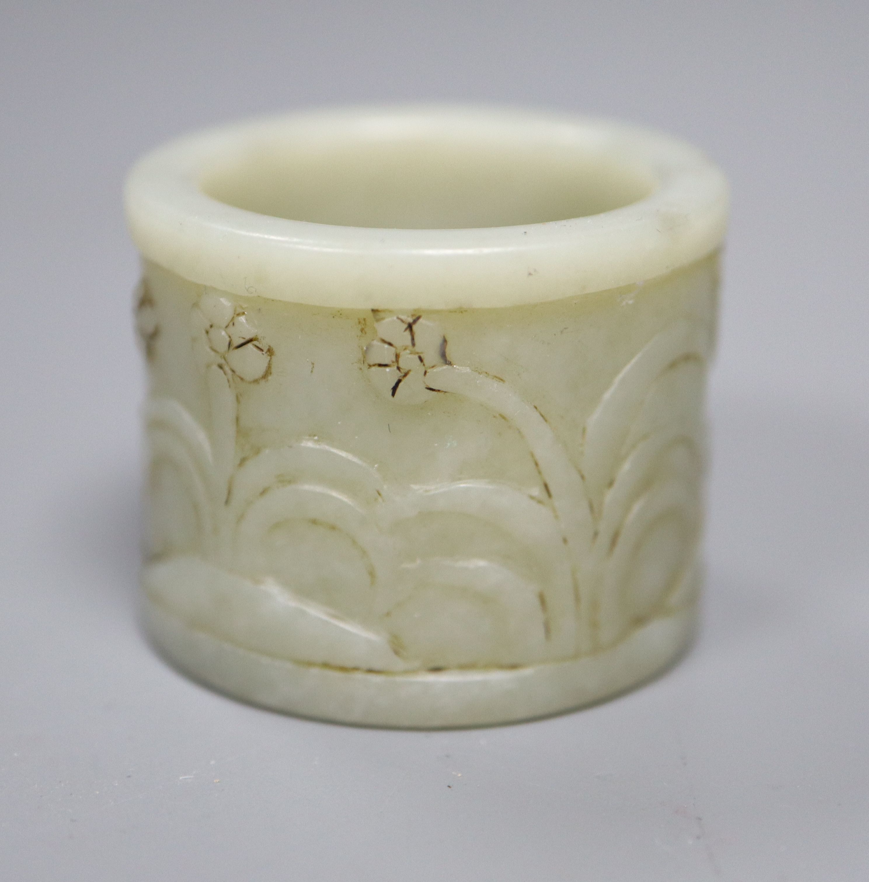 A Chinese pale celadon jade archers thumb ring